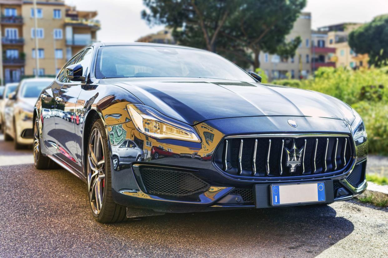 Rome,Italy - May 06, 2021: Elegant and modern fast and luxury Italian sedan car Maserati Quattroporte in blue navy color produced by Maserati automotive