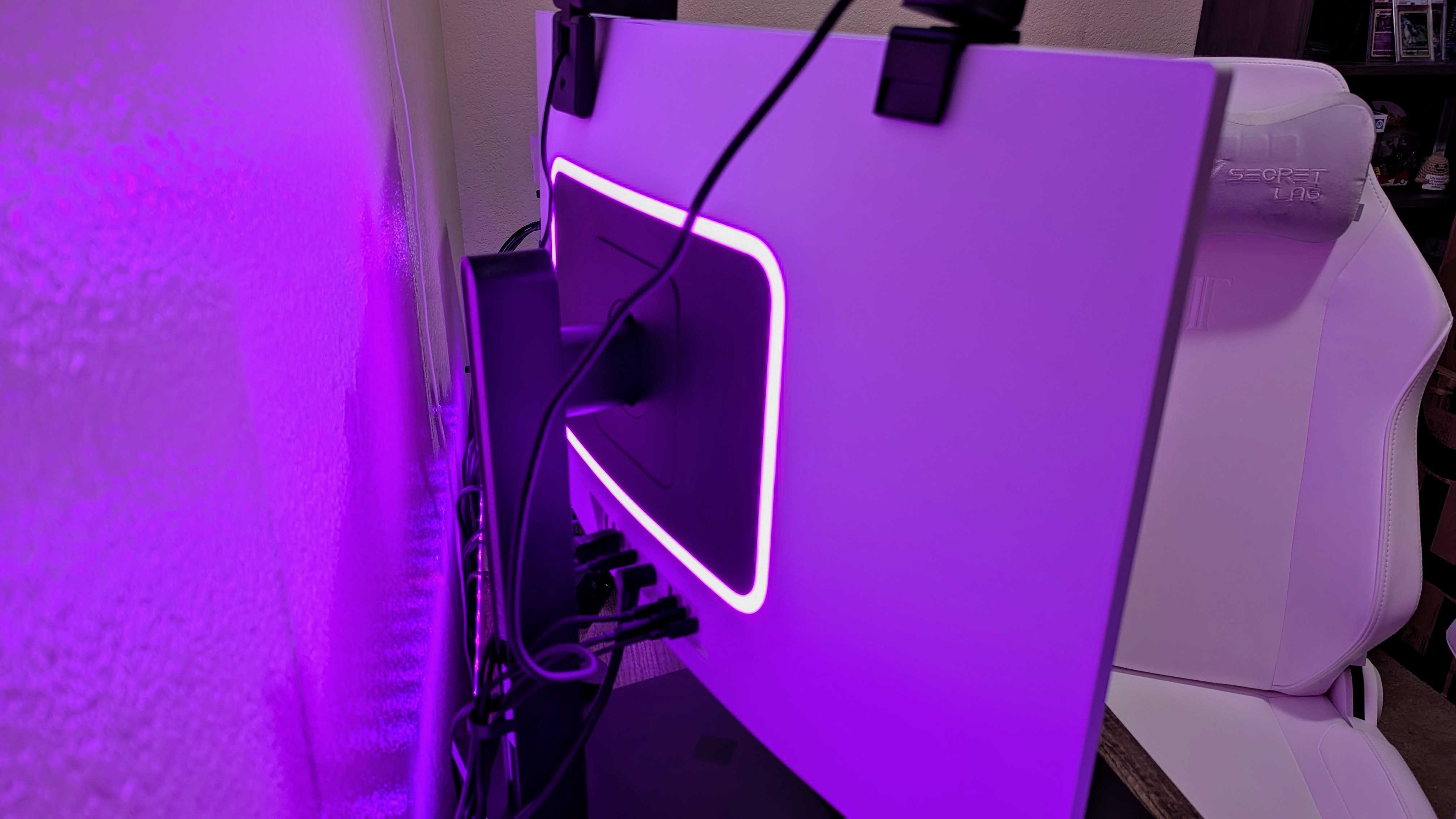 The HP OMEN Transcend 32 on a desk, seen from the rear to show its RGB lighting.