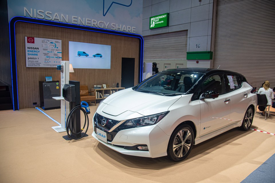 Nissan Leaf electric car on display at a car show.