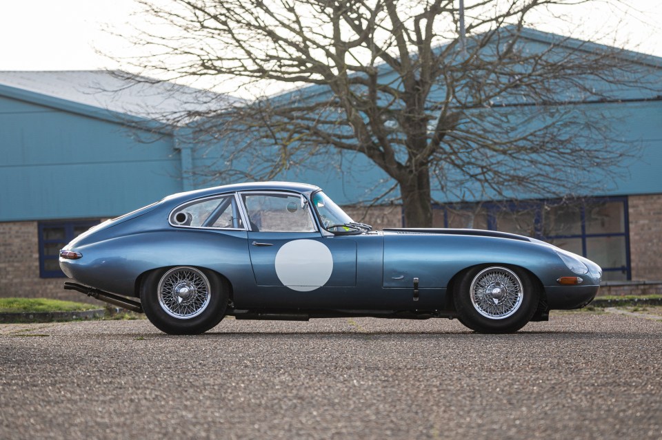 Blue 1961 Jaguar E-Type 3.8-litre Series 1 FHC race car.