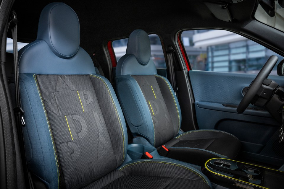 Car interior with blue and black seats.