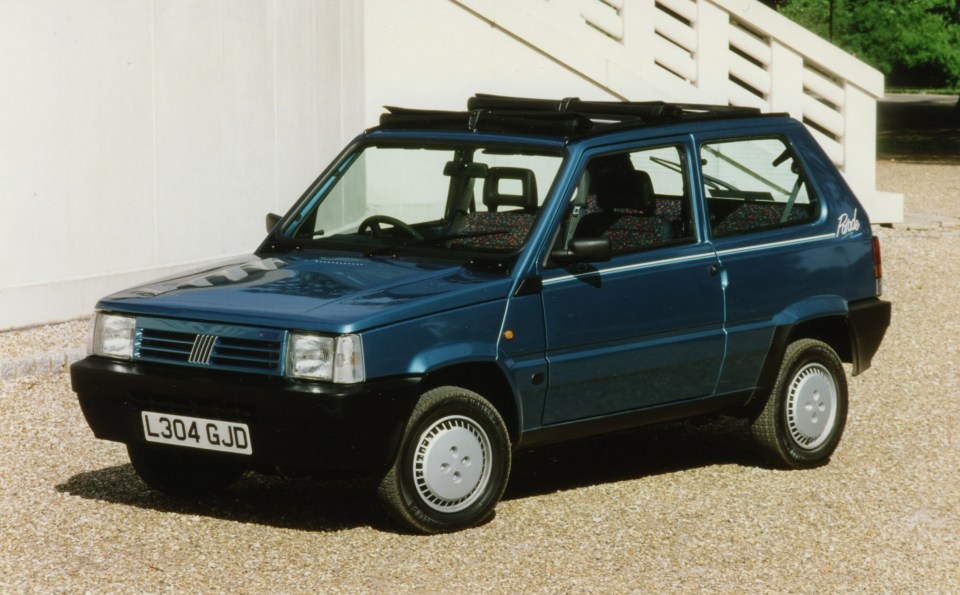 Blue Fiat Panda car with a roof rack.