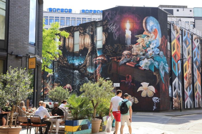 People eating outdoors in Shoreditch, London