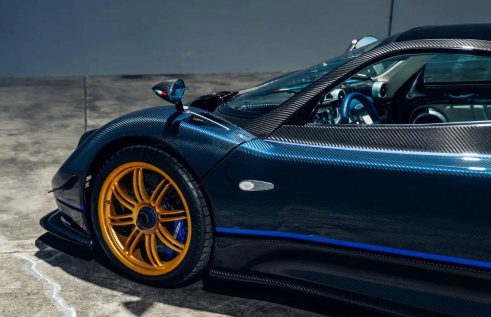 Stunning model finished in a clear blue lacquer coating This STATE-OF-THE-ART 2011 celebration Pagani Zonda Tricolore - with a 7.3-litre V12 engine - could be yours as it hits the market. The incredible supercar is one of three built to celebrate the 50th anniversary of the Frecce Tricolori - the aerobatic demonstration team of the Italian Air Force, known for its signature green, white, and red smoke trails. Images show the stunning model finished in a clear blue lacquer coating and matching the livery of the Frecce Tricolori¿s Aermacchi MB-339 jets with Italian flag pinstriping. The car features a small vertical fin on top of the engine cover that assists in channelling air into the engine and LED running lights below the headlights. This model is only the second of three Tricolore built and fitted with a 7.3-litre Mercedes-Benz AMG-sourced V-12 engine, producing 670 bhp and 780 nm of torque. The car is on sale via auction by RM Sotheby with the bidding opening on Monday, 24 February 2025. ¿This car is amongst the most desirable iterations of the vaunted Zonda,¿ reads the listing. ¿It is being offered from the collection of its third owner and currently registered in Germany. ¿The car is exceptionally well-preserved throughout, and at the time of cataloguing, its odometer shows 690 miles from new. ¿While the jets of the Frecce Tricolore perform aerobatics in the sky, the Tricolores aerobatics on four wheels is no less impressive to experience, and the Tricolore celebrates Italian passion and panache with flair equalled only by its aeronautical equivalent.¿ ENDS.