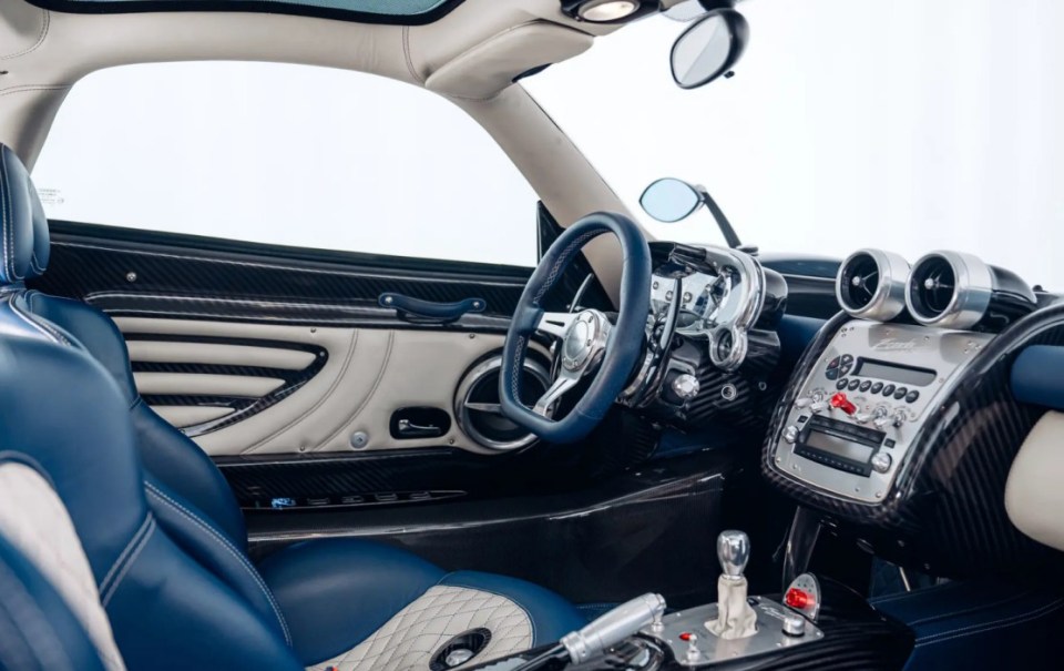 Beautiful Interior. This STATE-OF-THE-ART 2011 celebration Pagani Zonda Tricolore - with a 7.3-litre V12 engine - could be yours as it hits the market. The incredible supercar is one of three built to celebrate the 50th anniversary of the Frecce Tricolori - the aerobatic demonstration team of the Italian Air Force, known for its signature green, white, and red smoke trails. Images show the stunning model finished in a clear blue lacquer coating and matching the livery of the Frecce Tricolori¿s Aermacchi MB-339 jets with Italian flag pinstriping. The car features a small vertical fin on top of the engine cover that assists in channelling air into the engine and LED running lights below the headlights. This model is only the second of three Tricolore built and fitted with a 7.3-litre Mercedes-Benz AMG-sourced V-12 engine, producing 670 bhp and 780 nm of torque. The car is on sale via auction by RM Sotheby with the bidding opening on Monday, 24 February 2025. ¿This car is amongst the most desirable iterations of the vaunted Zonda,¿ reads the listing. ¿It is being offered from the collection of its third owner and currently registered in Germany. ¿The car is exceptionally well-preserved throughout, and at the time of cataloguing, its odometer shows 690 miles from new. ¿While the jets of the Frecce Tricolore perform aerobatics in the sky, the Tricolores aerobatics on four wheels is no less impressive to experience, and the Tricolore celebrates Italian passion and panache with flair equalled only by its aeronautical equivalent.¿ ENDS.