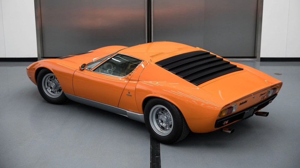 The Lamborghini is in amazing condition, USA, YOU COULD OWN this rare 1971 Lamborghini Miura P400 SV for ¿4M at auction. Images show this stunning Lamborghini finished in a unique combination of Arancio Miura or Miura Orange paintwork over a retro Goby sand interior. The Miura SV is one of only about 150 of its kind ever built, making it an incredibly rare find for collectors. One of the first 25 cars built, this Miura features early design elements such as the absence of ¿ears¿ on the wheel spinners and bodywork slats with rounded edges, marking it as a distinctive early example of the SV. This particular model is further distinguished by its European specification, devoid of U.S. specific safety features like side repeaters, and it is equipped with a matching numbers chassis and engine. Chassis No. 4854 and Engine No. 30647 trace a fascinating history, beginning with its delivery in July 1971 to Hubert Hahne, a renowned German racing driver and Lamborghini agent. This Miura has an illustrious provenance, having been part of the Rosso Bianco Collection for over three decades, where it shared space with some of the finest sports cars in the world. The car¿s remarkable journey included ownership by notable figures, such as former racing driver Peter Kaus. The meticulous nut-and-bolt restoration took place between 2014 and 2016 and cost close to ¿250K. It was carried out by award-winning Modenese Lamborghini experts, including Carrozzeria Cremonini handling the bodywork and Top Motors working on the mechanicals, alongside other industry leaders. The 1971 Lamborghini Miura P400 SV is set to be auctioned at The Amelia Auction in 2025. ¿The car's striking original colours were briefly altered, as records show it was painted in Luci del Bosco Green before its first private owner, but it has since been restored to its original Miura Orange exterior. "By the early 1980s, the car was acquired by former racing driver and renowned collector Peter Kaus," who added it to his world-famous collection. ¿During this time, the car showed around 60,000 kilometers, believed to be original, before it was sold and carefully restored. "Any Miura SV is a rare motorcar. ¿But an SV such as this, restored to its original and correct specification by the very best craftsmen in Modena, is truly a rare opportunity." ENDS