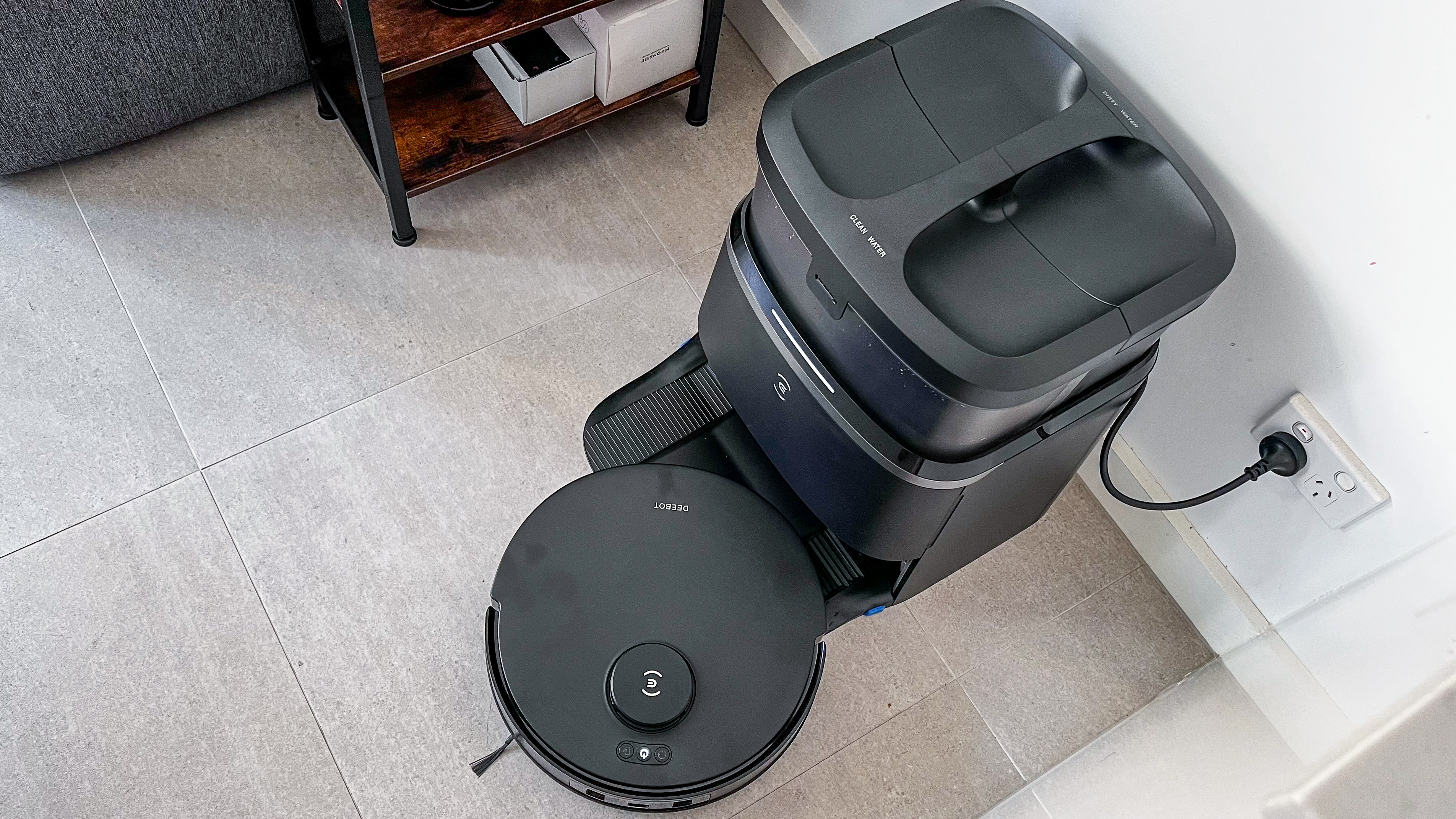 Ecovacs Deebot T30 Omni robot vacuum pulling out of its clean station