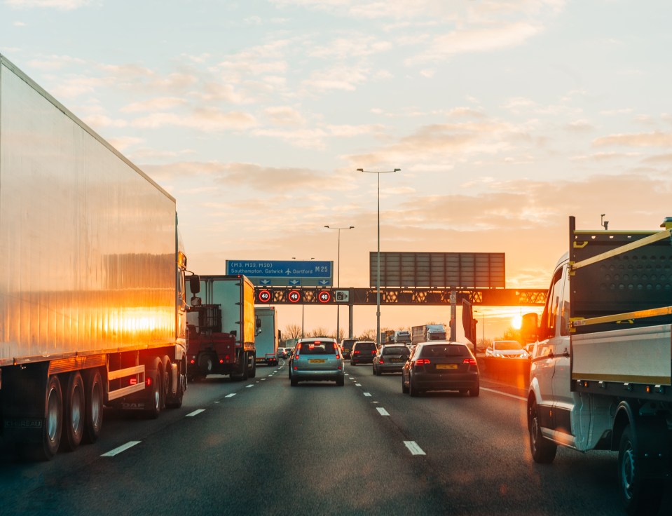 Traffic jam at sunset on a UK highway.