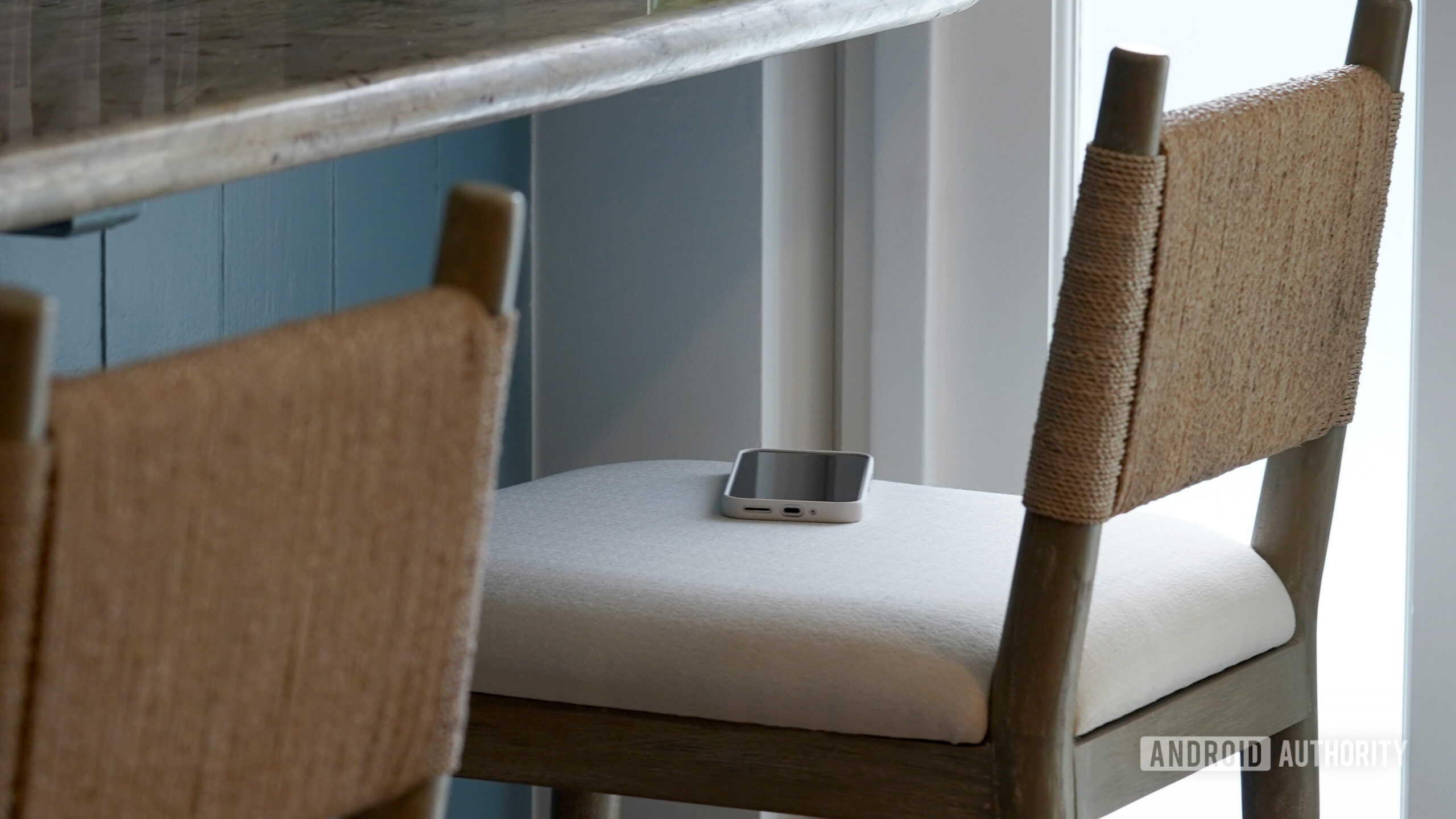 A Google Pixel 9 rests forgotten on a bar stool.