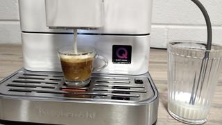 Milk being dispensed into macchiato using KitchenAid Fully Automatic Espresso Machine KF6