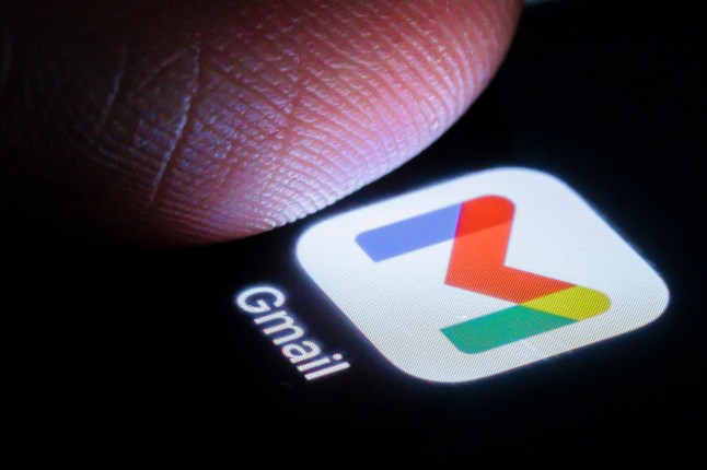 BERLIN, GERMANY - MARCH 27: In this photo illustration the gmail app can be seen on a smartphone next to a finger on March 27, 2024 in Berlin, Germany. (Photo Illustration by Thomas Trutschel/Photothek via Getty Images)