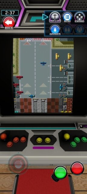 Tiny retro plane flying on virtual arcade machine