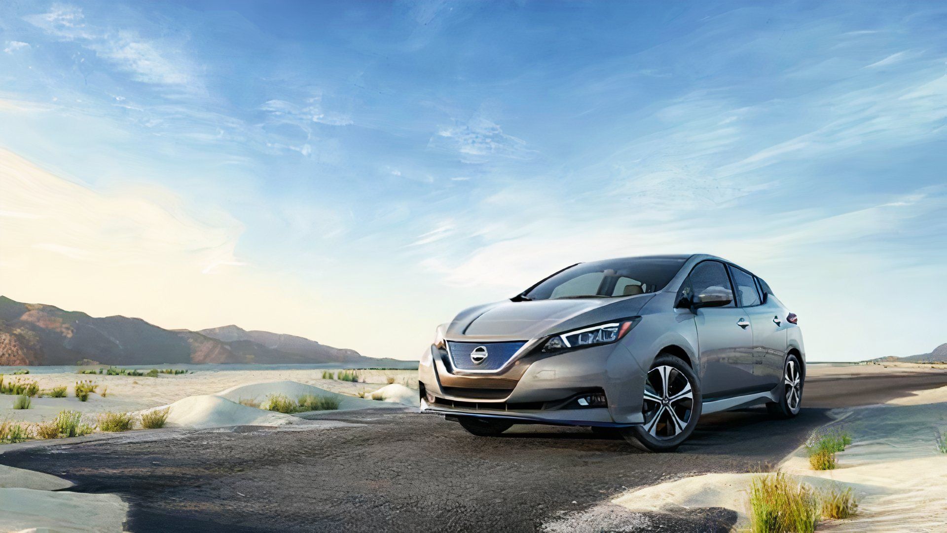 A gray 2022 Nissan Leaf is parked. 