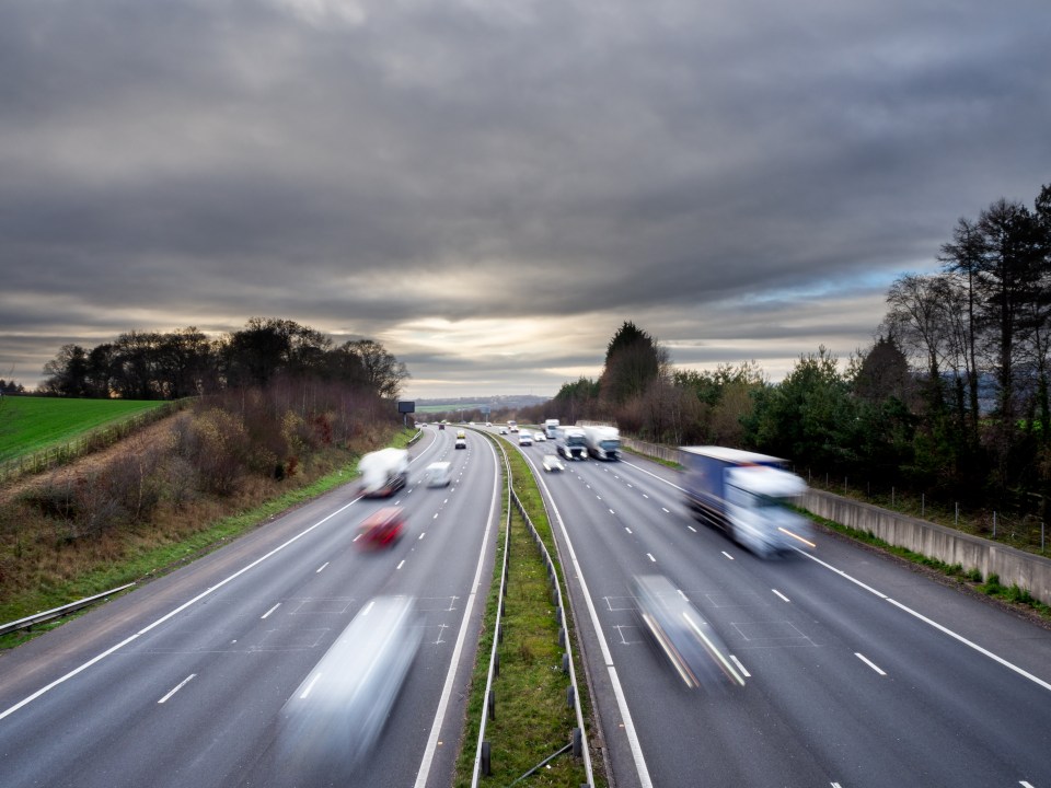 Traffic moving on a multi-lane highway.