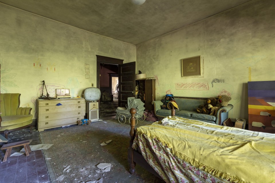 What appears to be a childs bedroom complete with toys GEORGIA, USA THIS VINTAGE car collector abandoned his home over a decade ago yet his hoard of classic American cars stands as a testament to the petrol-head¿s passion¿¿Images show a valuable collection of vintage cars including a Pacard, a Cadillac sedan and multiple Buicks.¿Evidence in the home suggest the property has been abandoned for 15 years as the last calendar hanging is dated 2008.¿¿These images were captured by urban explorer Leland Kent known online as Abandoned Southeast in Georgia, USA.¿¿¿The former home of an antique car collector sits deep in the woods of rural Georgia,¿ said Leland on his blog.¿¿¿According to property records, the home dates to the early 20th century, although it appears it could be much older.¿¿¿It has a unique layout with attached rooms rather than a central hallway.¿¿¿In the kitchen, there is a calendar dated 2008 that gives some indication of when the house was last occupied.¿¿¿In the small, detached garage behind the house are a Packard and Cadillac sedan, as well as several old Buicks.¿¿Find out more on Lelands Blog.¿¿ENDS