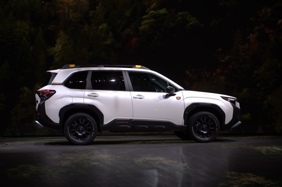 Side view of a white Subaru Forester Wilderness.