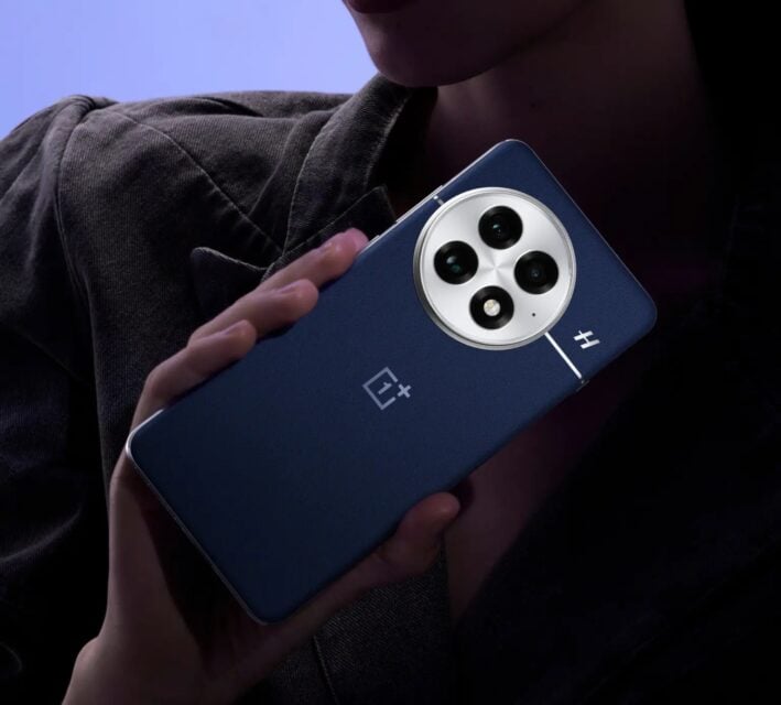 Hand holding OnePlus 13 with design clearly visible