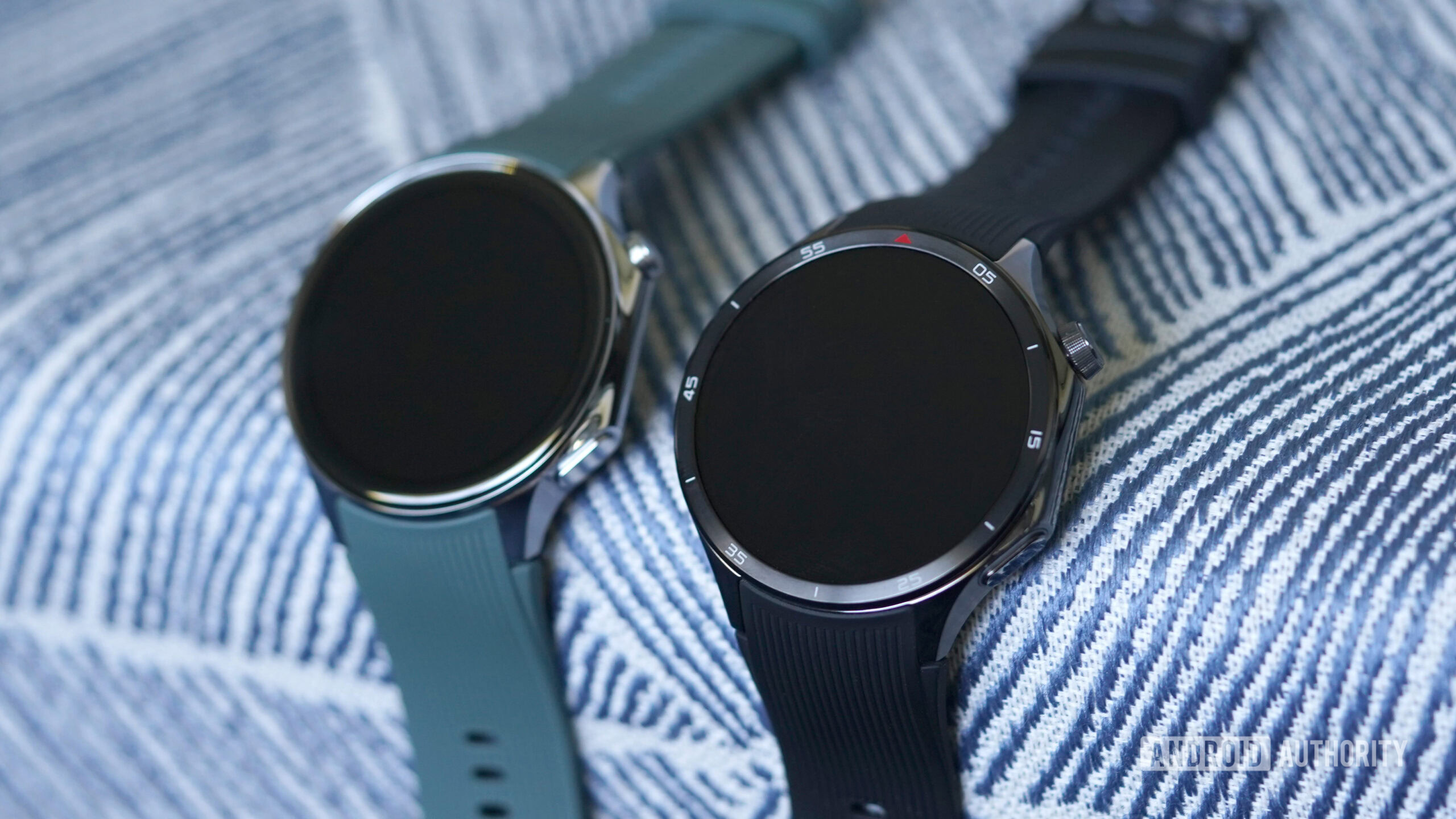 A OnePlus Watch 3 rests alongside a Watch 2.