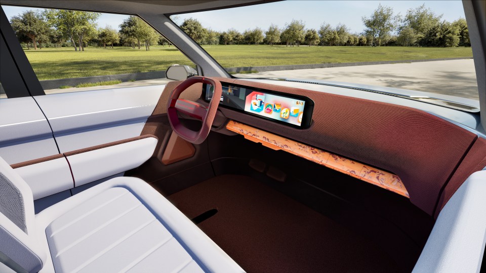 Interior view of the Kia EV4, showing the dashboard and passenger seat.