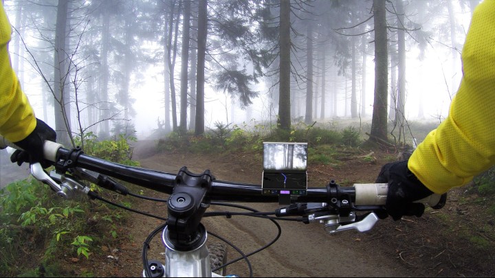 Infinix S Zero tri-fold phone concept mounted on a bike.