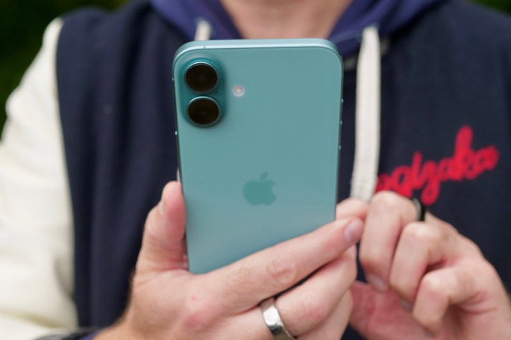 A person holding the Apple iPhone 16 Plus.