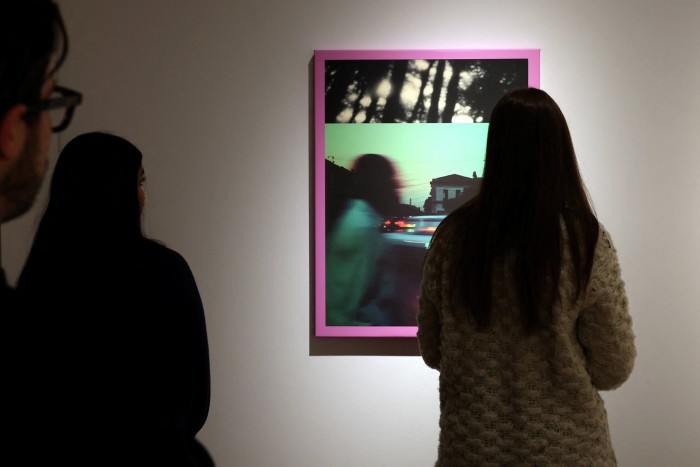 Visitors look at Linda Dounia Rebeiz’s ‘14° 40′ 34.46″ N 17° 26′ 15.14″ W’ at Christie’s Auctions in New York City, US