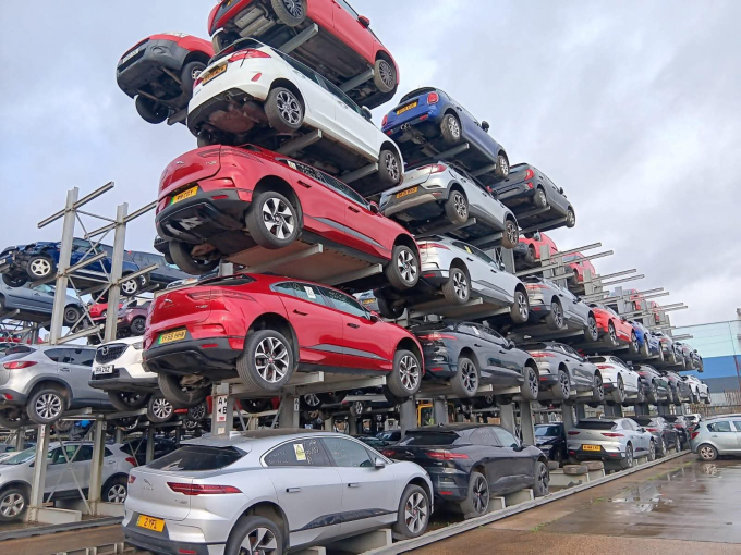 Dozens of Jaguar I-Pace EVs stacked up in a scrapyard in Charles Trent, U.K. Photo from Threads/Ev_Newt