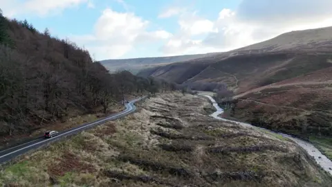 PA Media Aerial view of Snake Pass with the River Ashop on the right side of the image