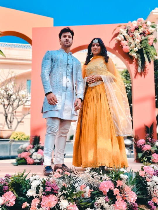 Portrait of an Indian bride and groom at their wedding ceremony shot on Vivo V50 with Zeiss effects and Aura Light.