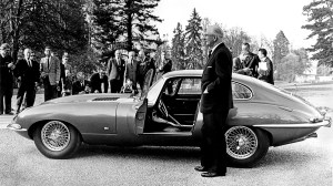 Lyons presents the Jaguar E-Type Coupe 9600 HP to an international press corps in Geneva in 1961.