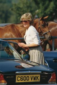 Princess Diana with a Jaguar XJ Sovereign at a 1987 polo match.