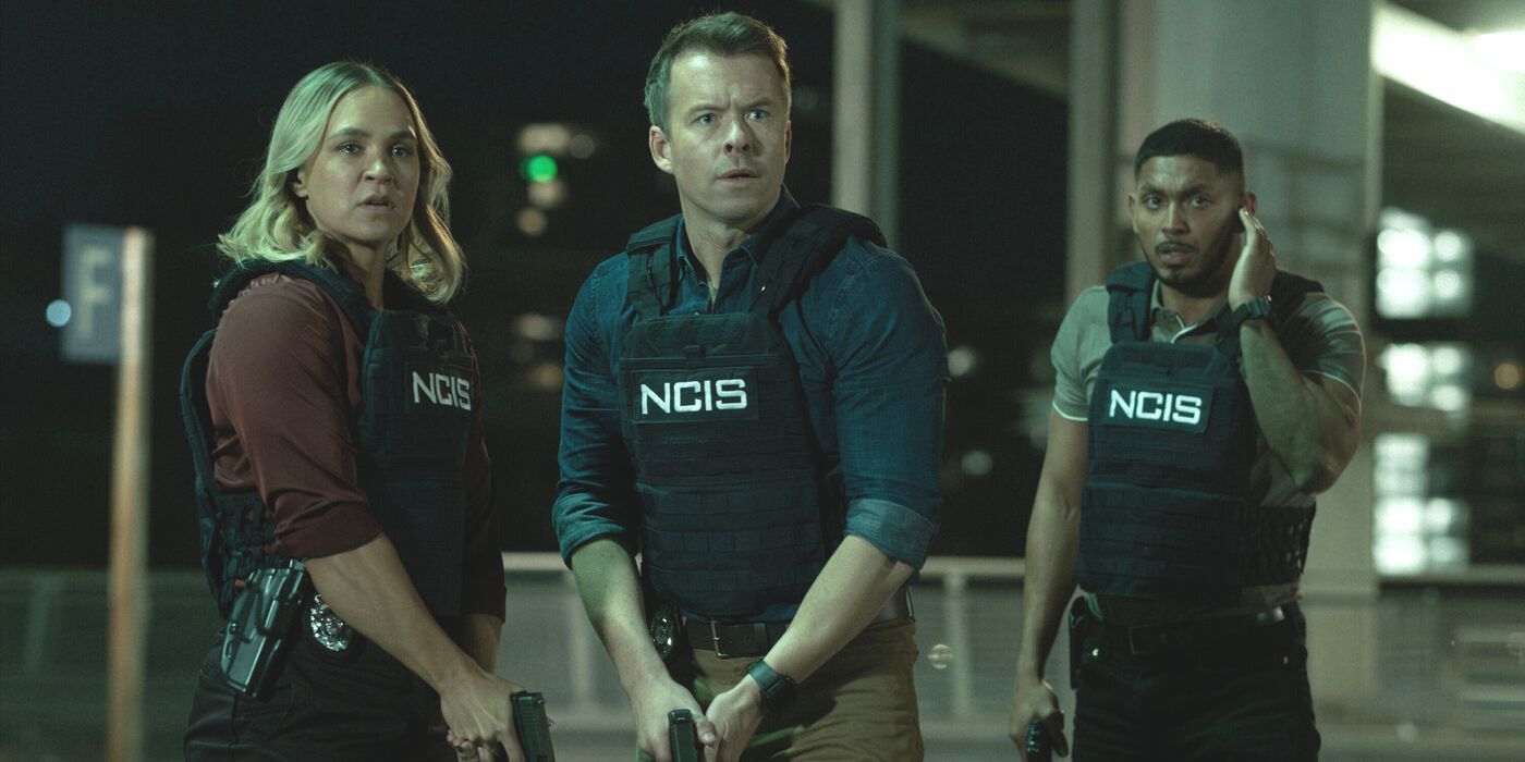 Evie Cooper, JD Dempsey and DeShawn Jackson wearing NCIS vests on a garage rooftop in NCIS: Sydney