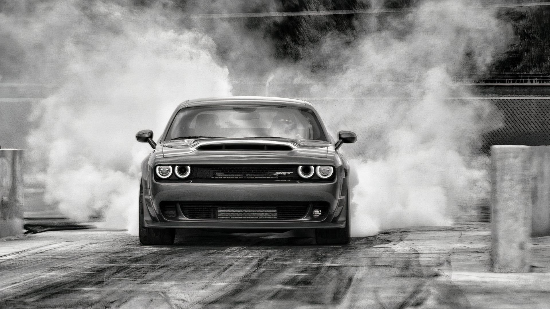 Dodge Challenger performing burnout, front profile view