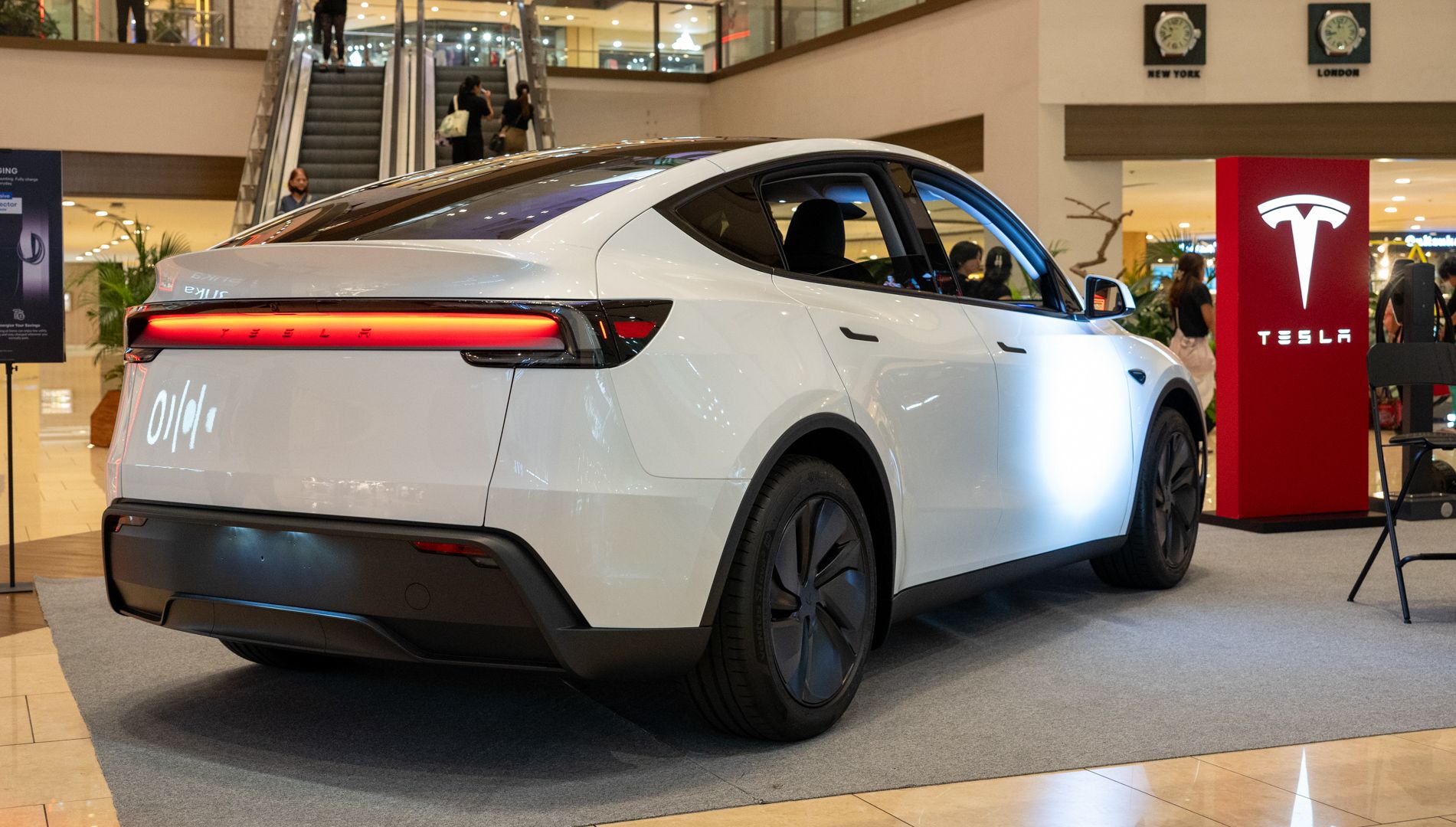 Rear 3/4 view of a 2025 Tesla Model Y