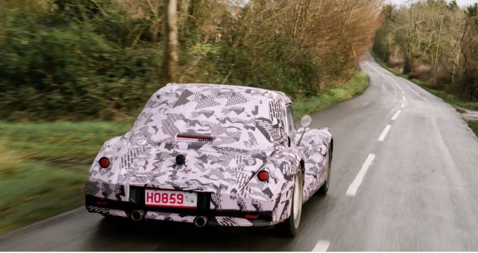 Rear view of a camouflaged New Morgan car driven by Richard Hammond.