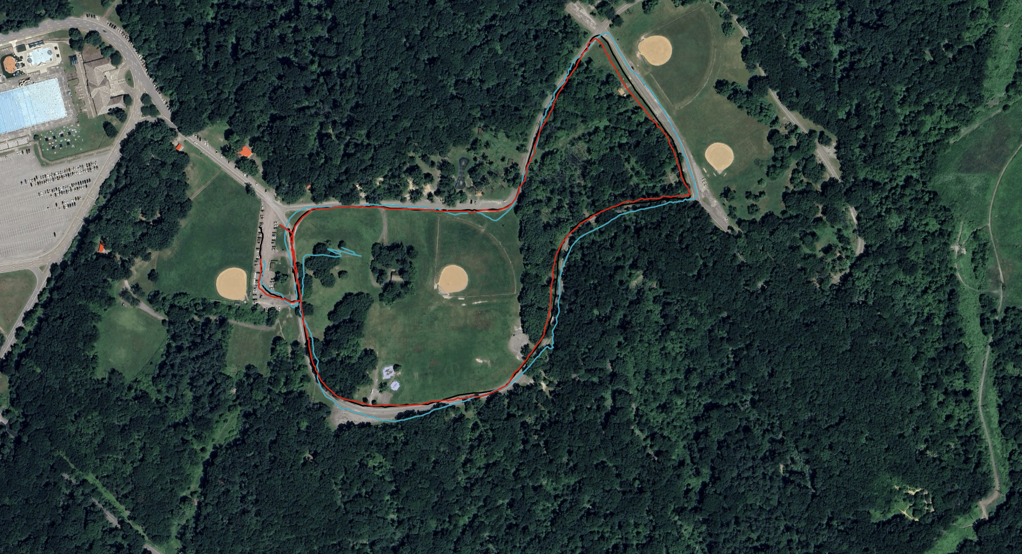 Three GPS tracks on a satellite view of a park. All three track together pretty closely.