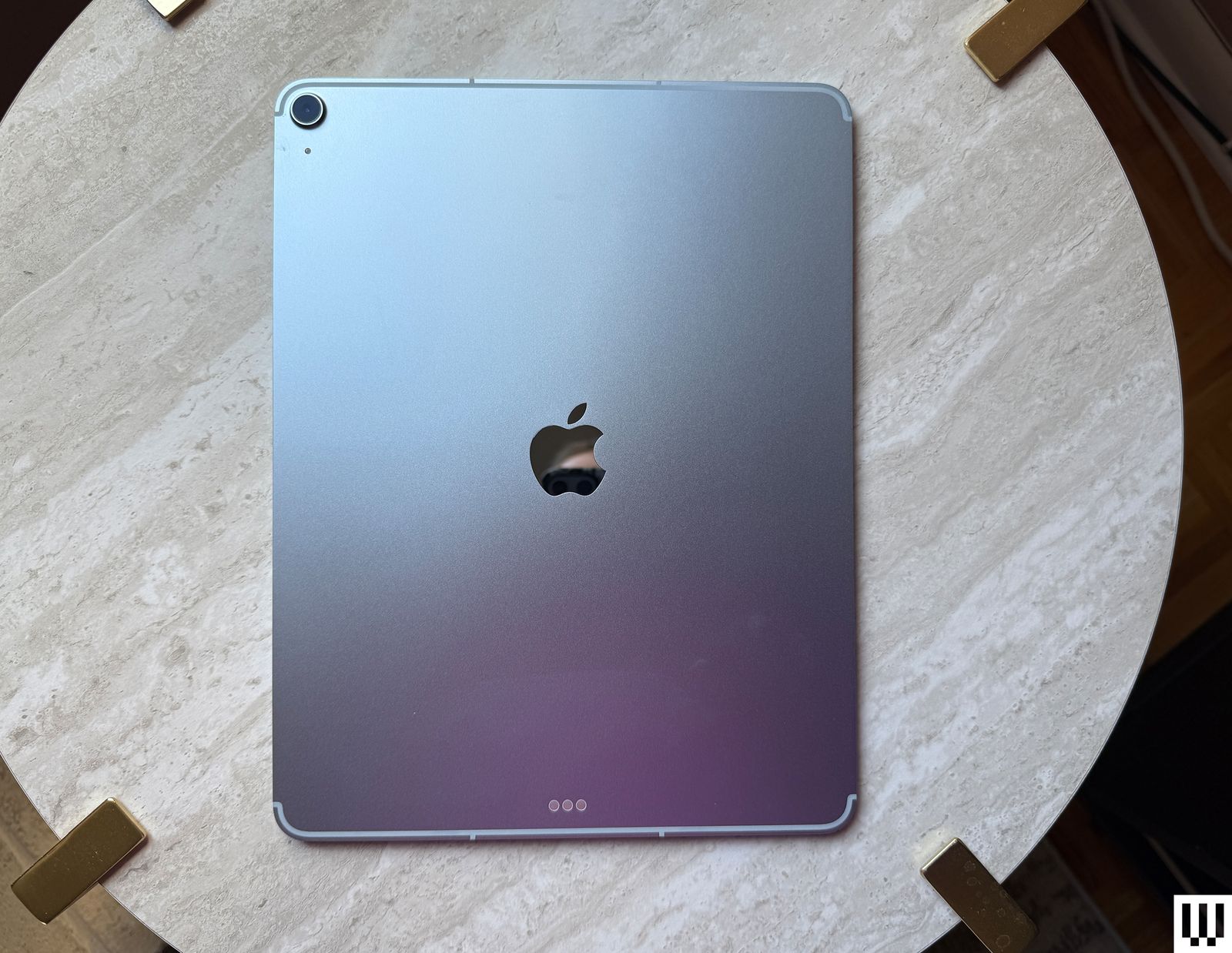 Overhead view of the back of an Apple iPad Air M3 2025 with the silver coating