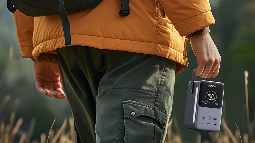 Hiker carrying UGREEN 300W 48000mAh Power Bank