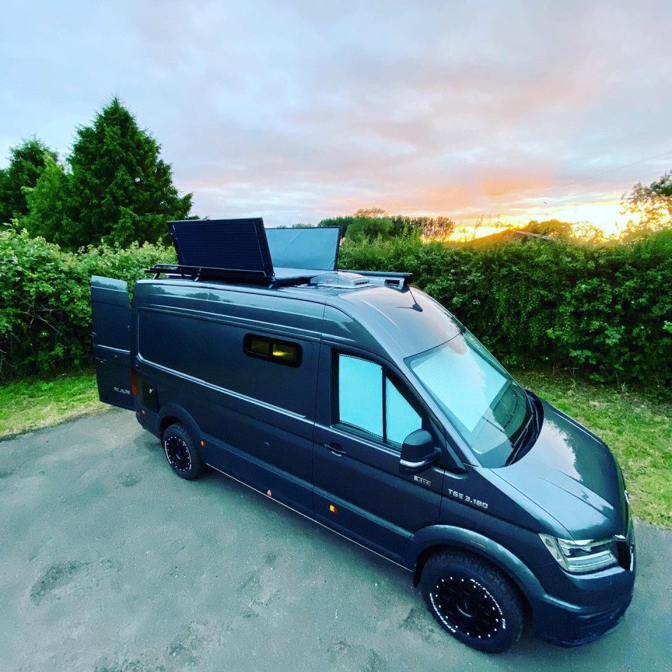 Custom-built van with solar panels on the roof.