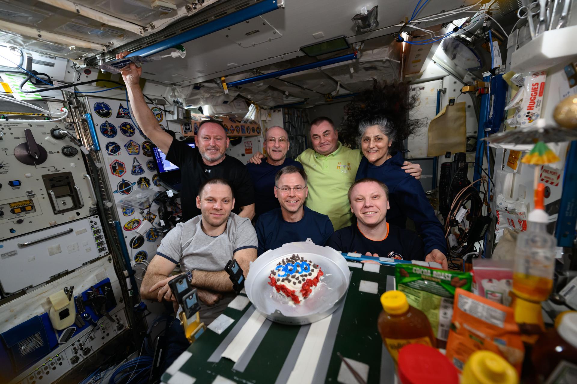 Williams (back far right), Wilmore (back far left), and the rest of the Expedition 72 crew pose for a portrait inside the International Space Station’s Harmony module. Wilmore and Williams have been on the orbiting laboratory since last June