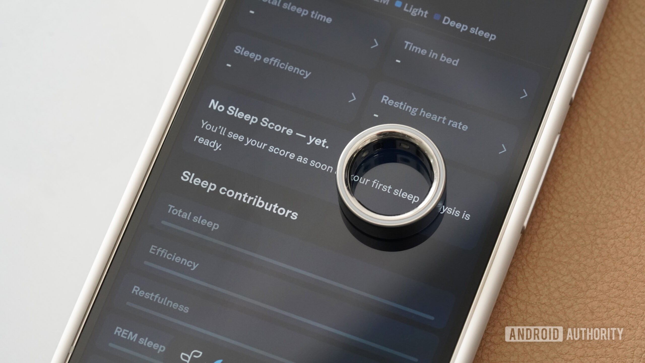 A user checks their data in the Oura companion app.