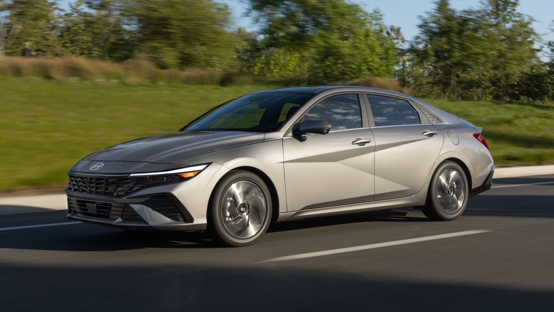 Silver Elantra Hybrid driving