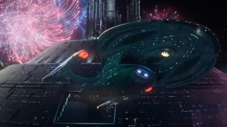 The Enterprise-F, against a sky full of fireworks, a scene from Star Trek: Picard.