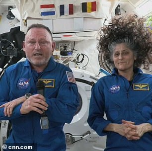 AFTER: Wiliams and Wimore pictured on the ISS. Away from the pull of gravity fluids shift towards the head, leading to unusual appearances