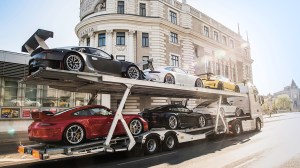 The The “Six Cars, One Truck” Porsche 911 GT collection on a trailer