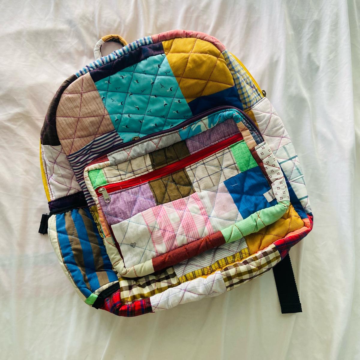 A bag made with patches of discarded fabric