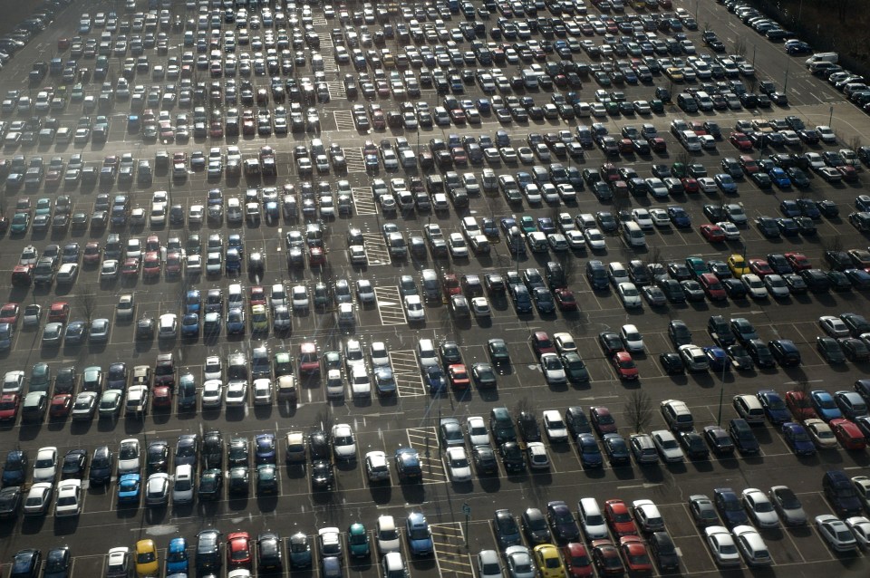 a lot of cars are parked in a parking lot