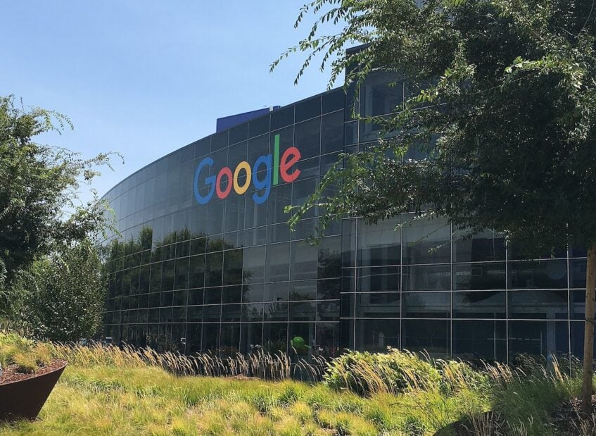 Glass building with Google logo in front