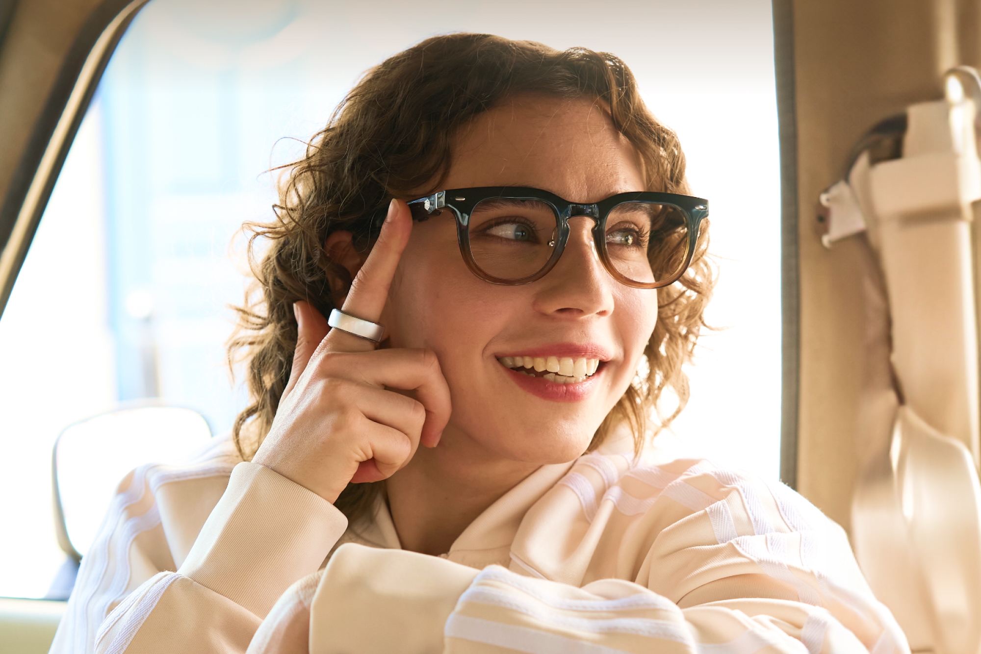 A model wearing the Halliday AI Glasses and smart ring.