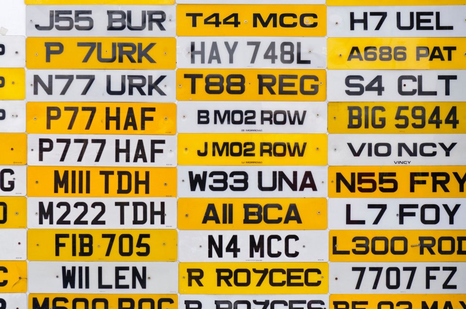 Many UK car number plates.